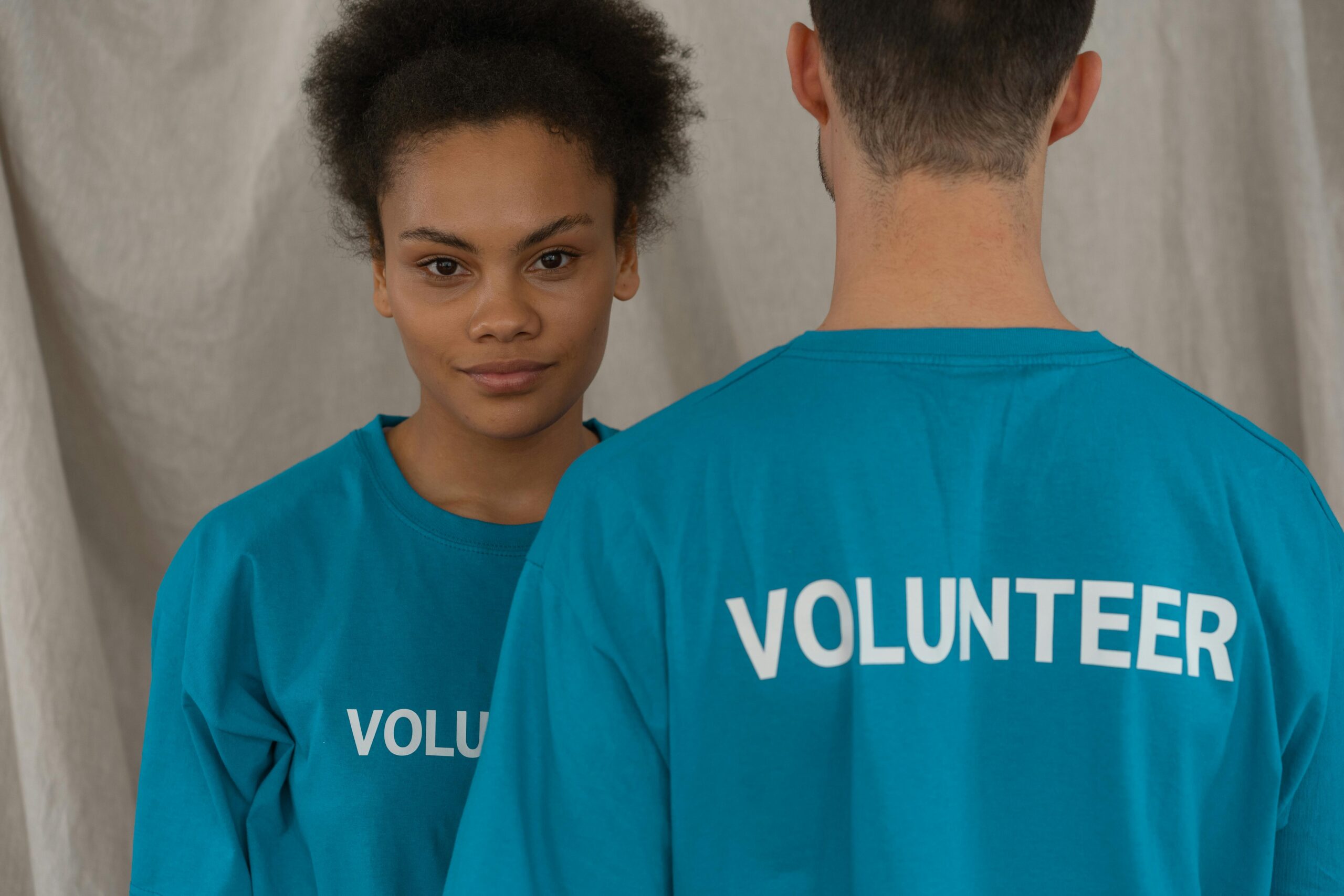 volunteers in blue shirts